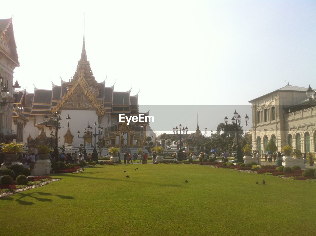 Lawn outside grand palace against clear sky