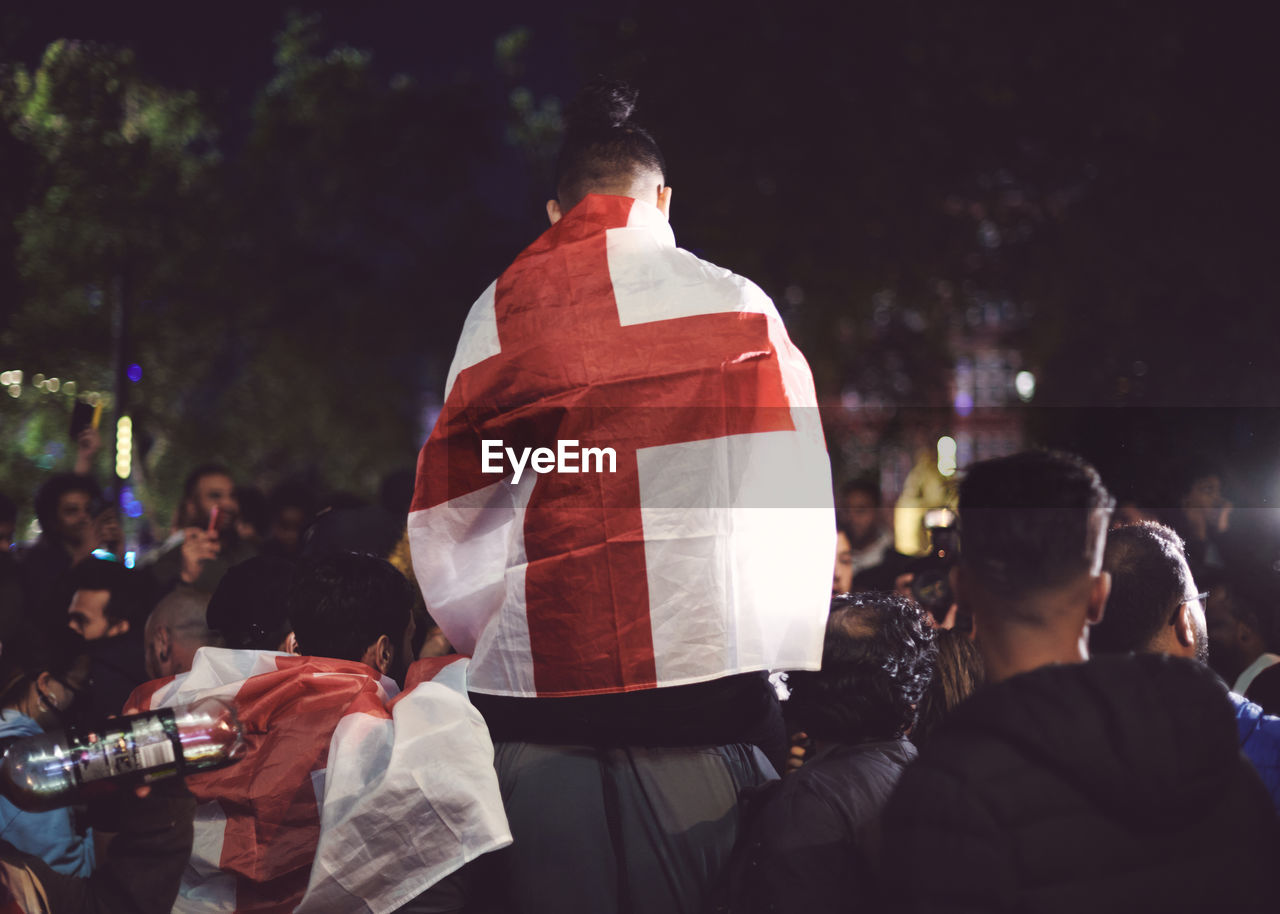 Rear view of football fans with england flag