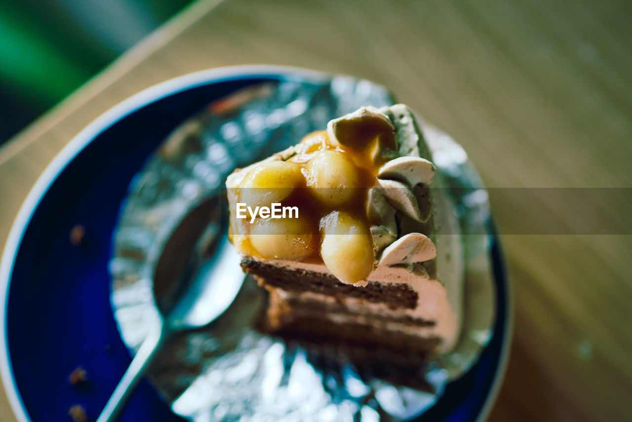 CLOSE-UP OF CAKE WITH SLICE IN PLATE