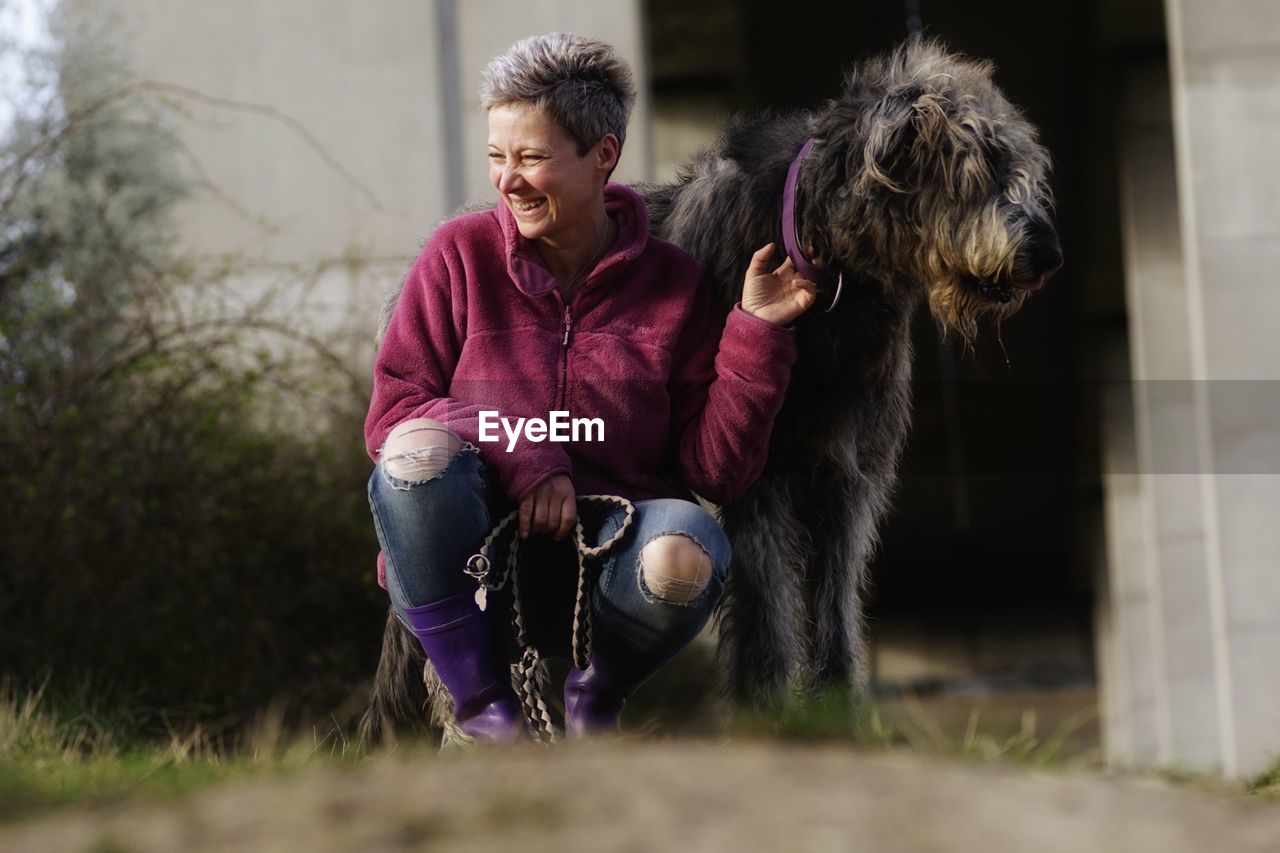 Woman with dog outdoors