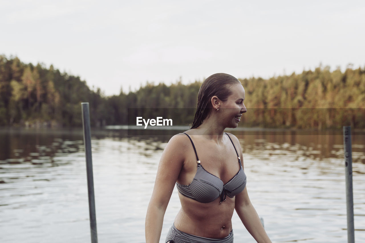 Happy woman at lake