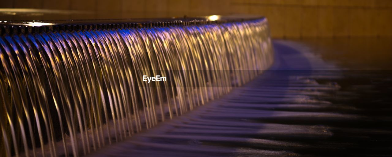 CLOSE-UP OF ILLUMINATED LIGHTING EQUIPMENT IN INDUSTRY