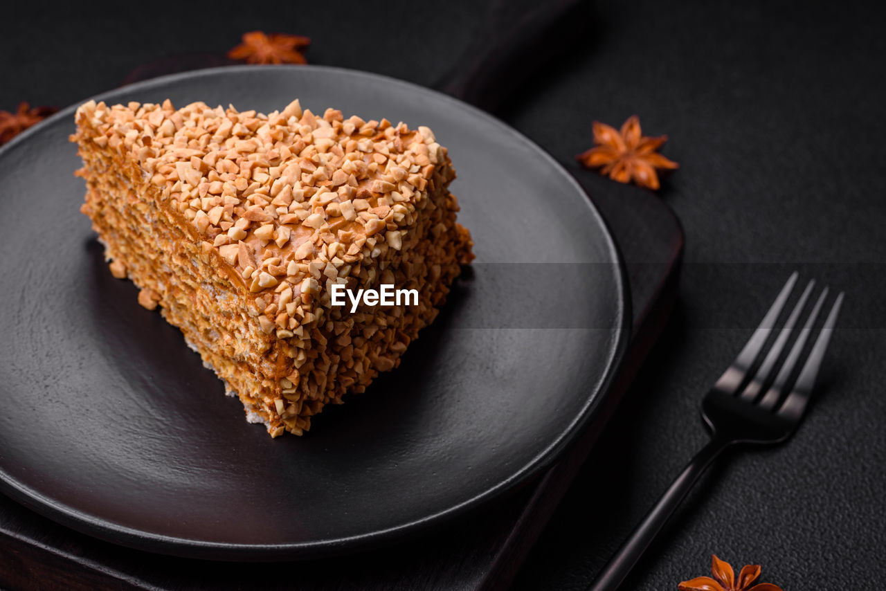 food, food and drink, plate, sweet food, freshness, eating utensil, kitchen utensil, fork, sweet, baked, healthy eating, dessert, meal, no people, wellbeing, cake, studio shot, dish, fruit, indoors, nut, produce, gourmet, nut - food, black background