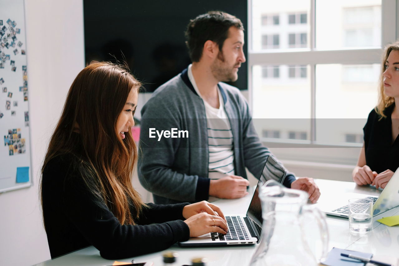 View of people in office meeting