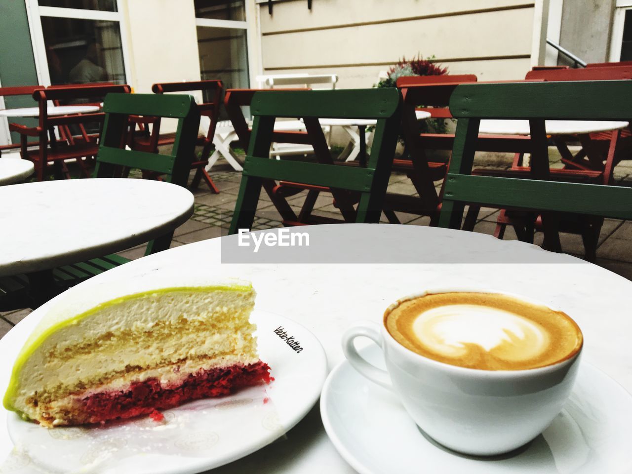 CLOSE-UP OF CAPPUCCINO SERVED ON TABLE AT CAFE