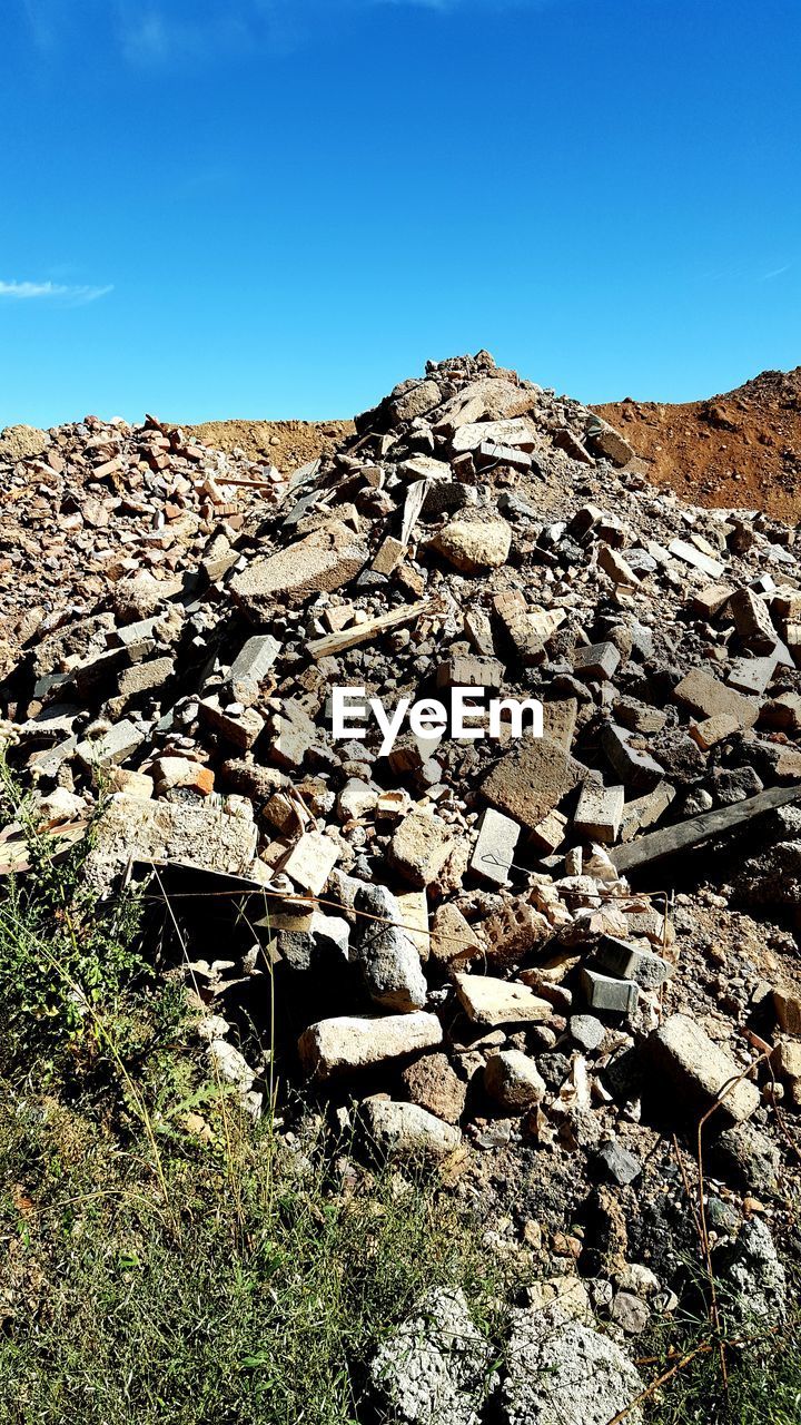 SURFACE LEVEL OF ROCKY MOUNTAIN AGAINST CLEAR BLUE SKY