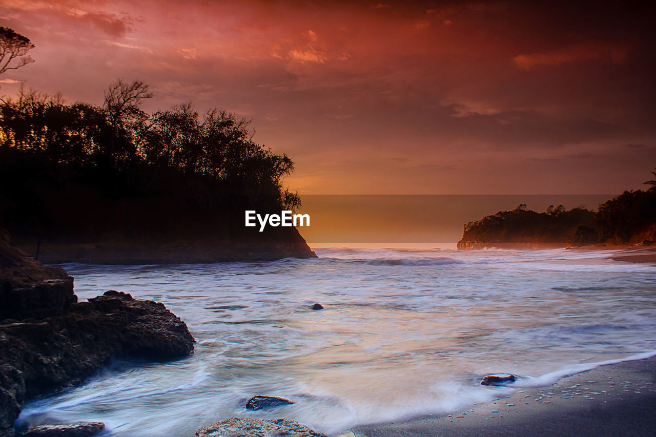 Scenic view of sea against sky during sunset