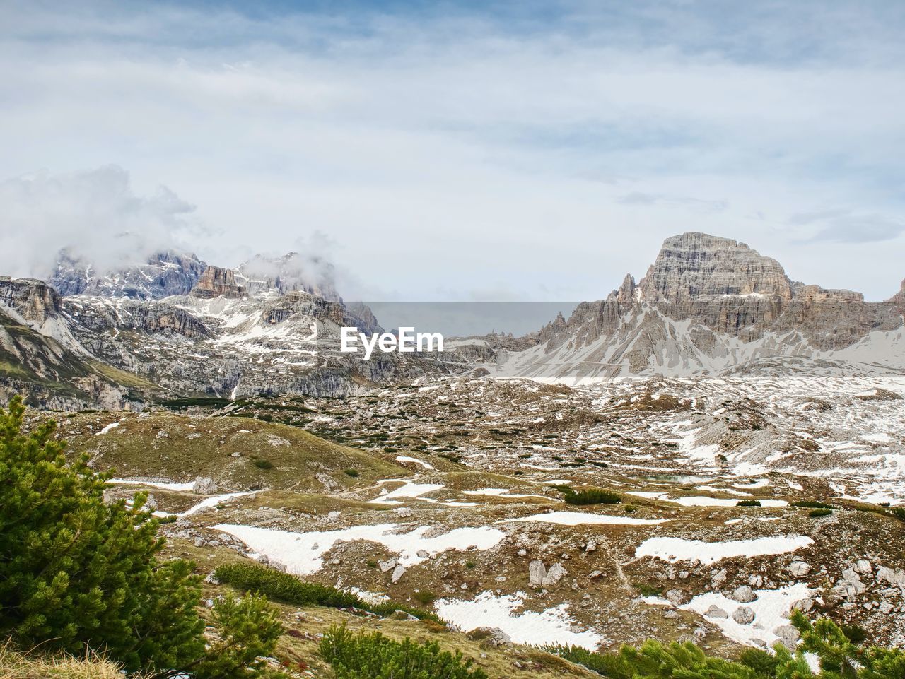 Sharp alps peaks rocks without people. view over alpine rocks above deep vallyes to far horizon