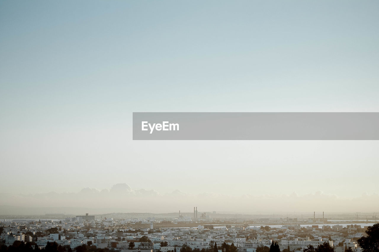 View of cityscape against clear sky