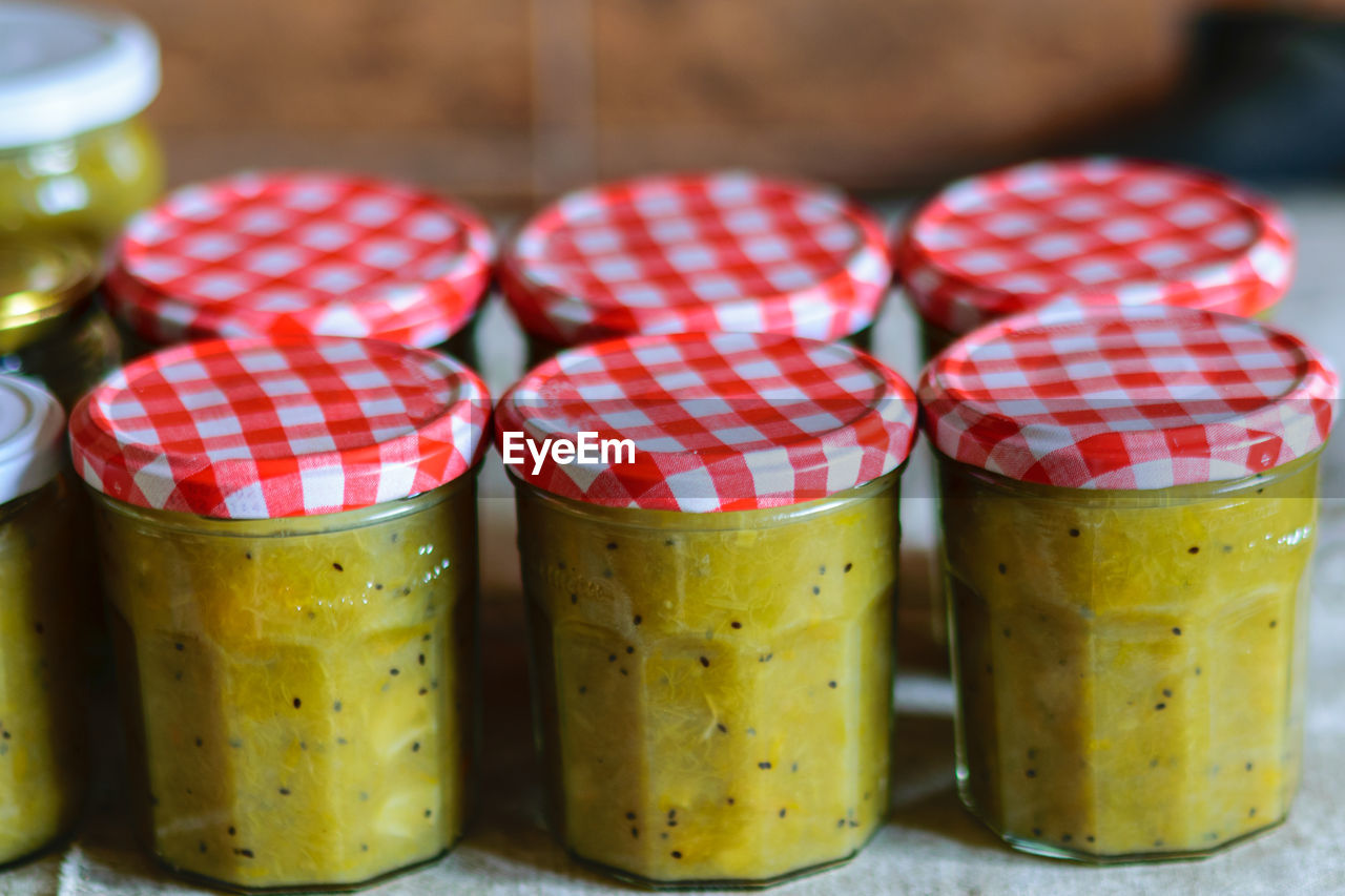 food and drink, food, healthy eating, produce, fruit, close-up, focus on foreground, no people, indoors, wellbeing, freshness, container, red, multi colored, group of objects, preserved food, in a row