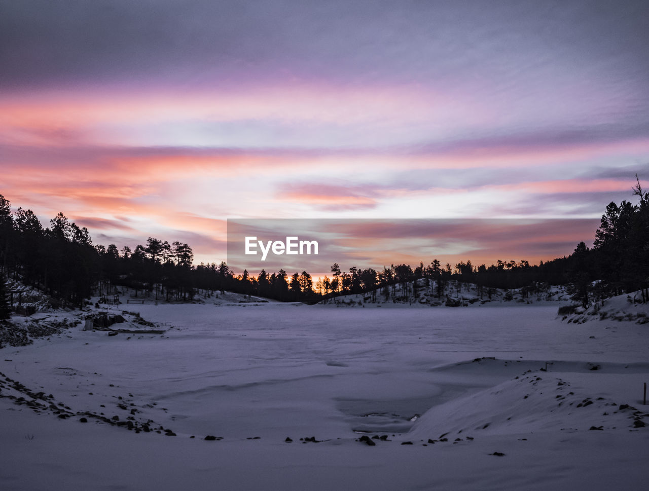 Scenic view of landscape against sky during sunset