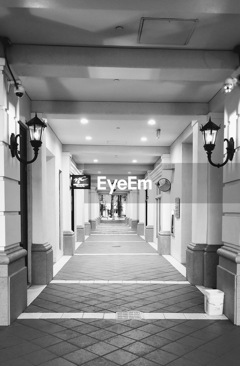 CORRIDOR IN ILLUMINATED UNDERGROUND WALKWAY