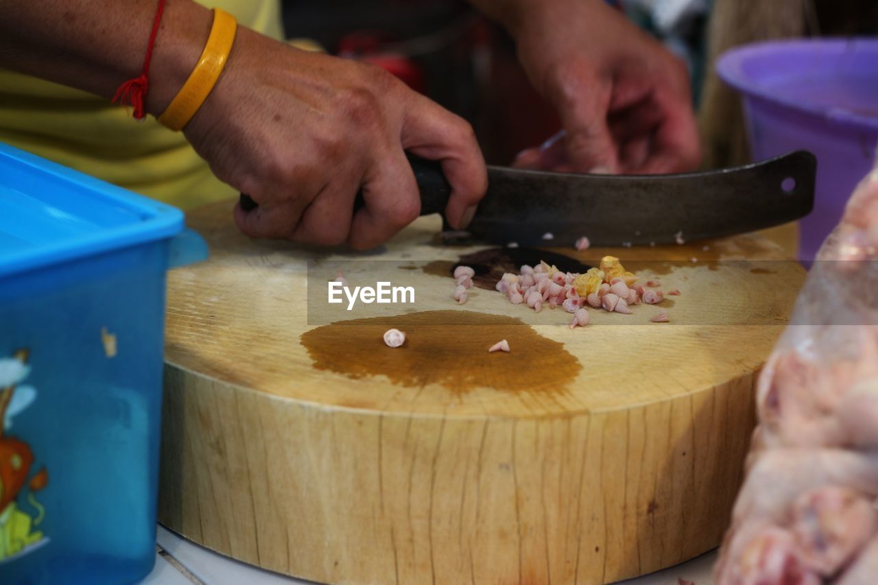 Close-up of man preparing food