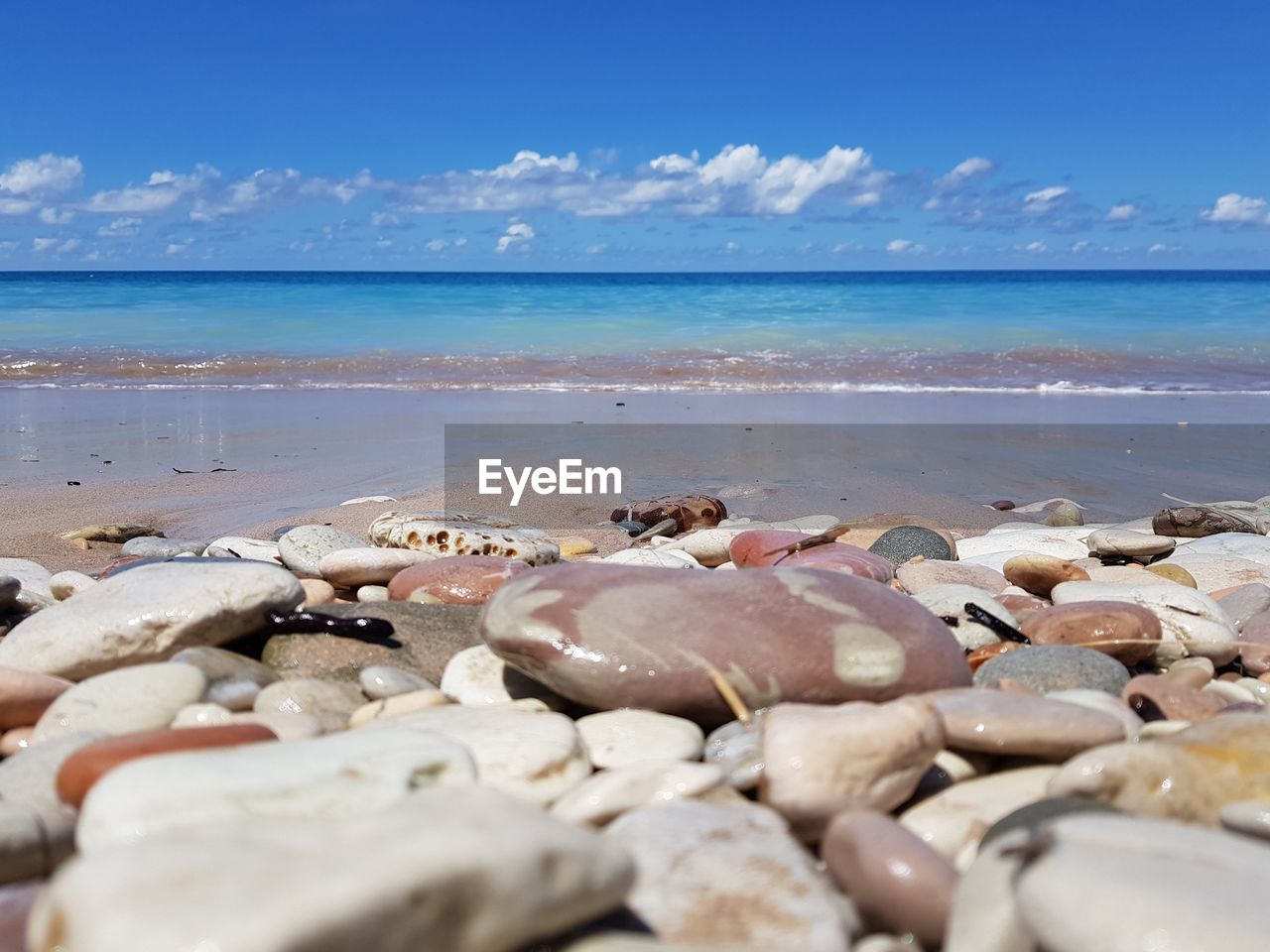 VIEW OF PEBBLES ON BEACH