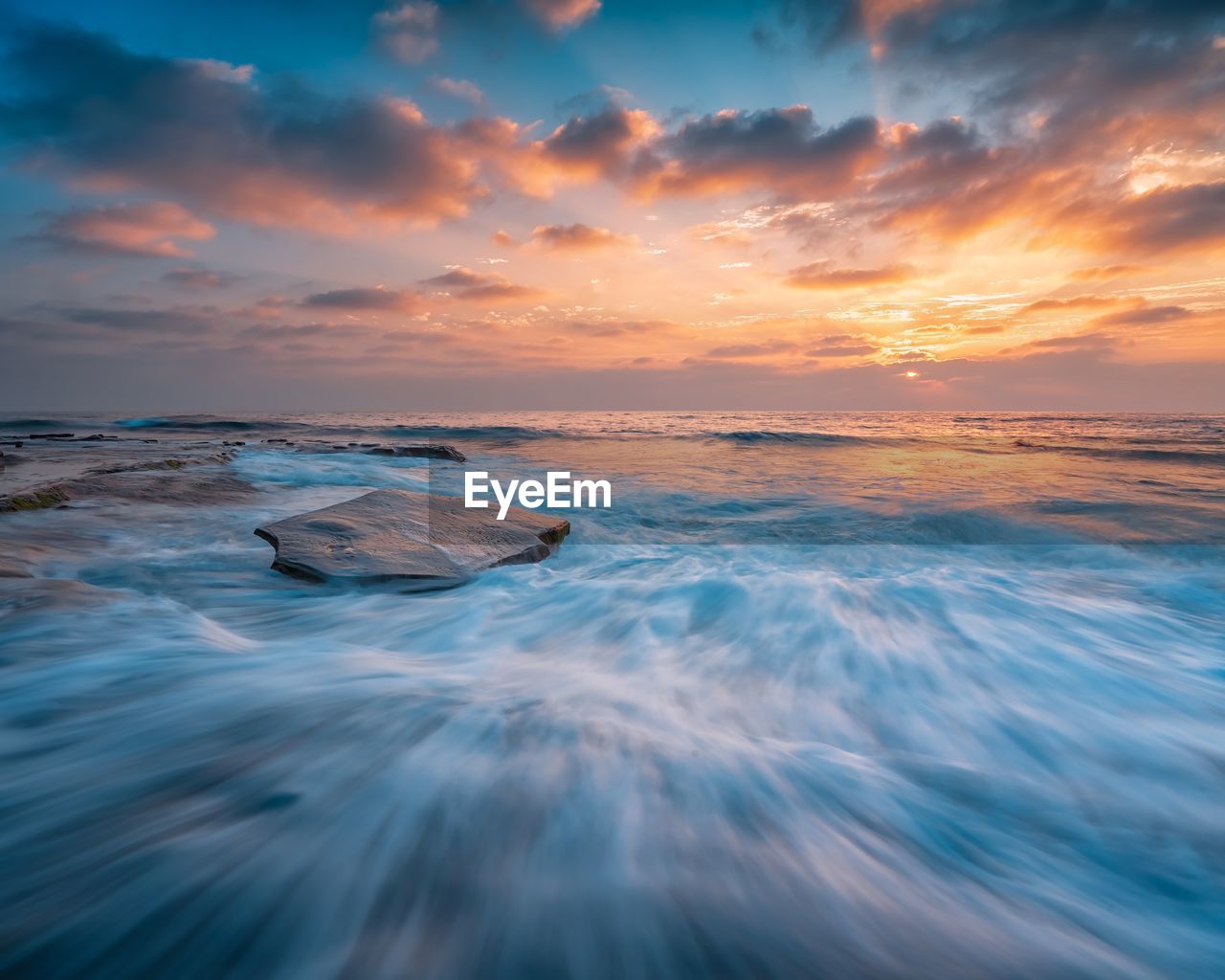 Scenic view of sea against sky during sunset