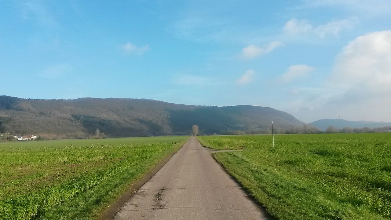 ROAD PASSING THROUGH MOUNTAINS