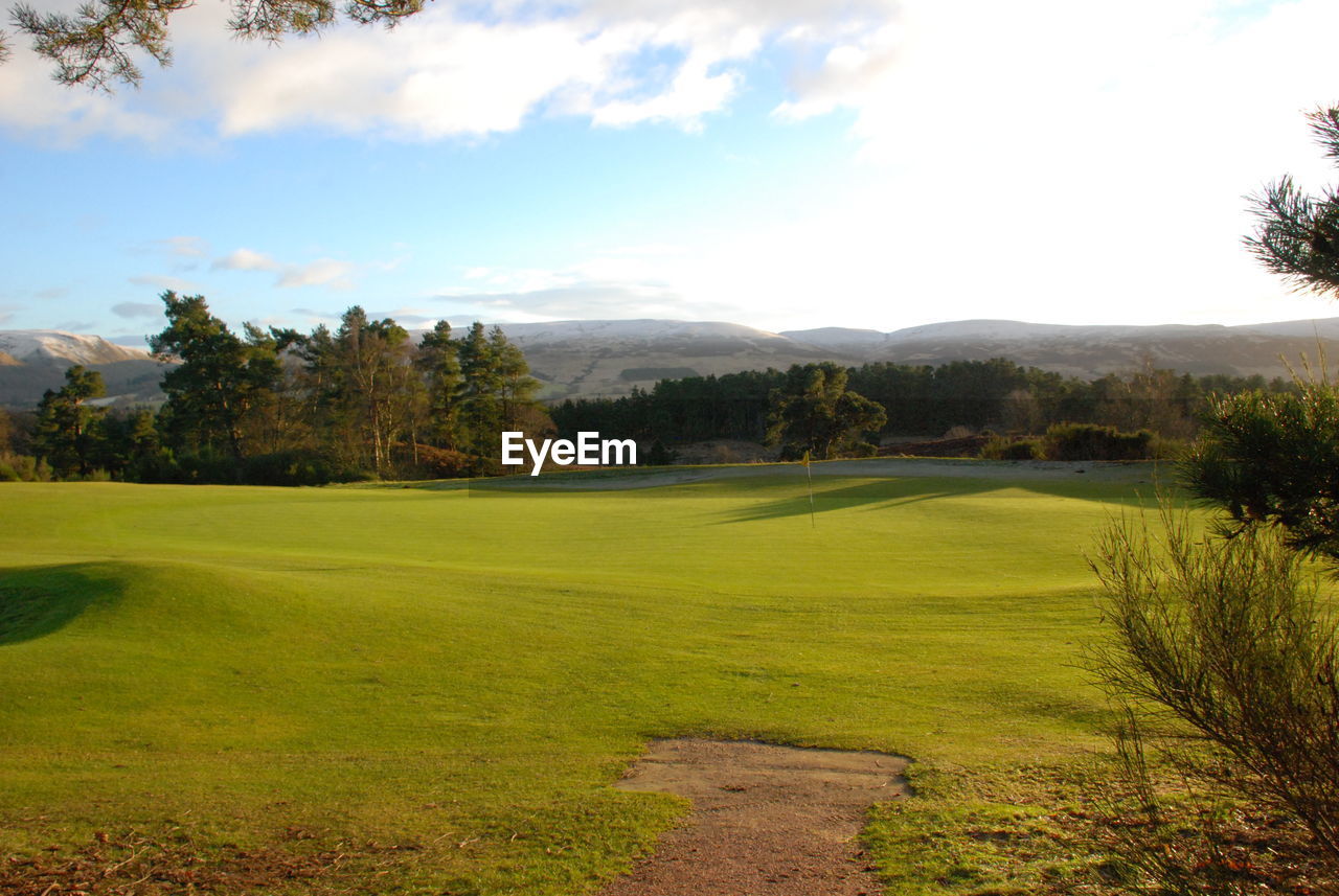VIEW OF GOLF COURSE AGAINST SKY