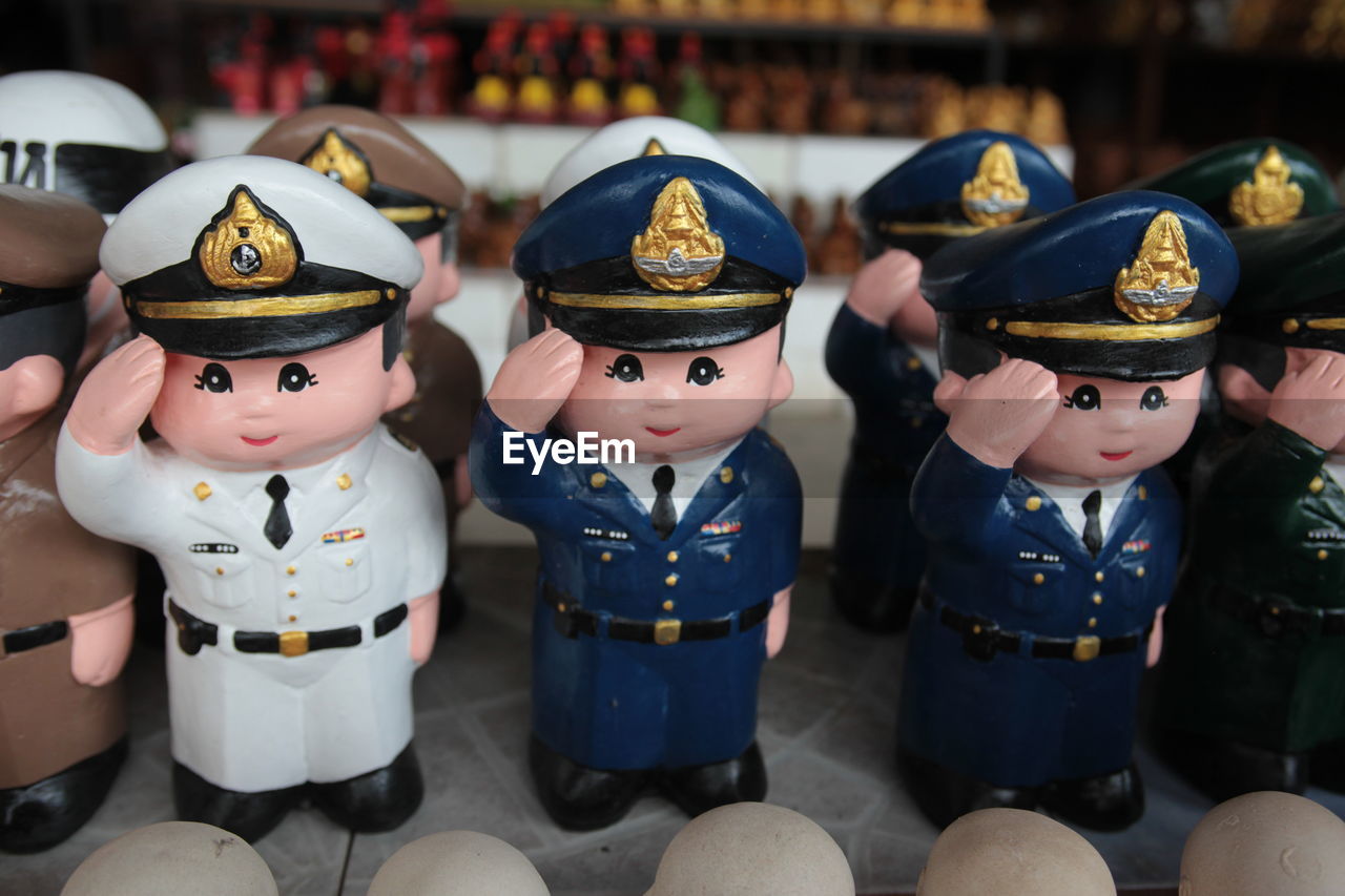 Close-up of male statues at market stall