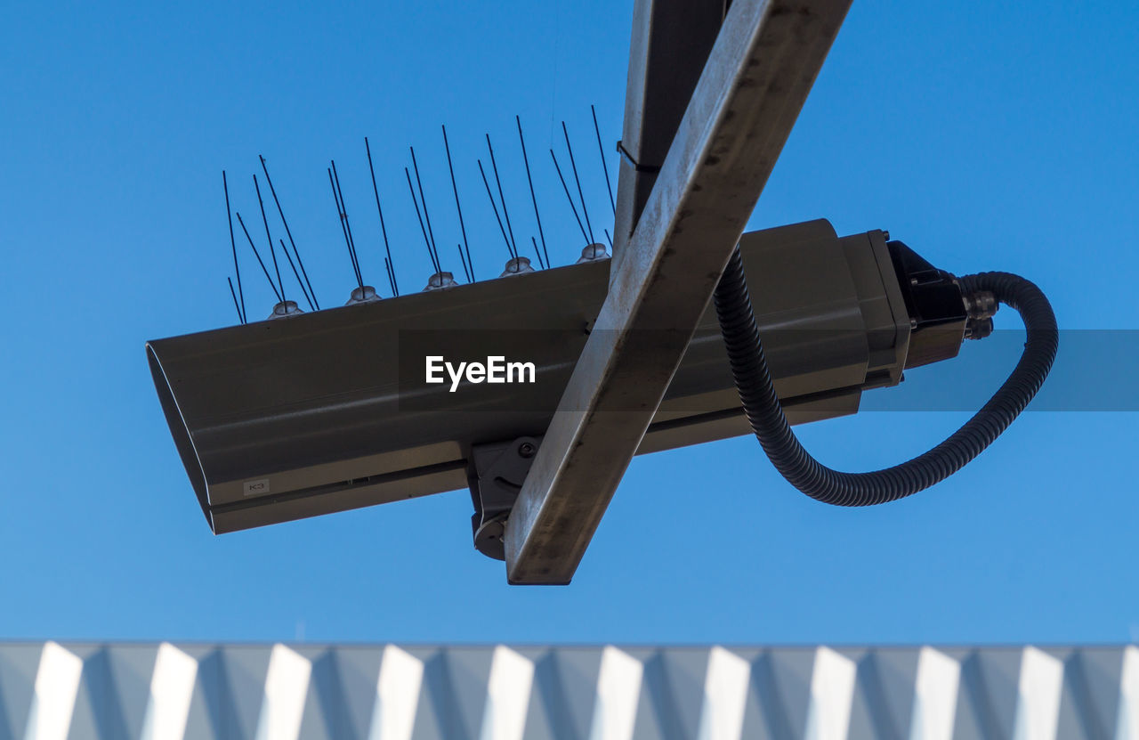 LOW ANGLE VIEW OF BUILT STRUCTURE AGAINST BLUE SKY AND CLEAR BACKGROUND