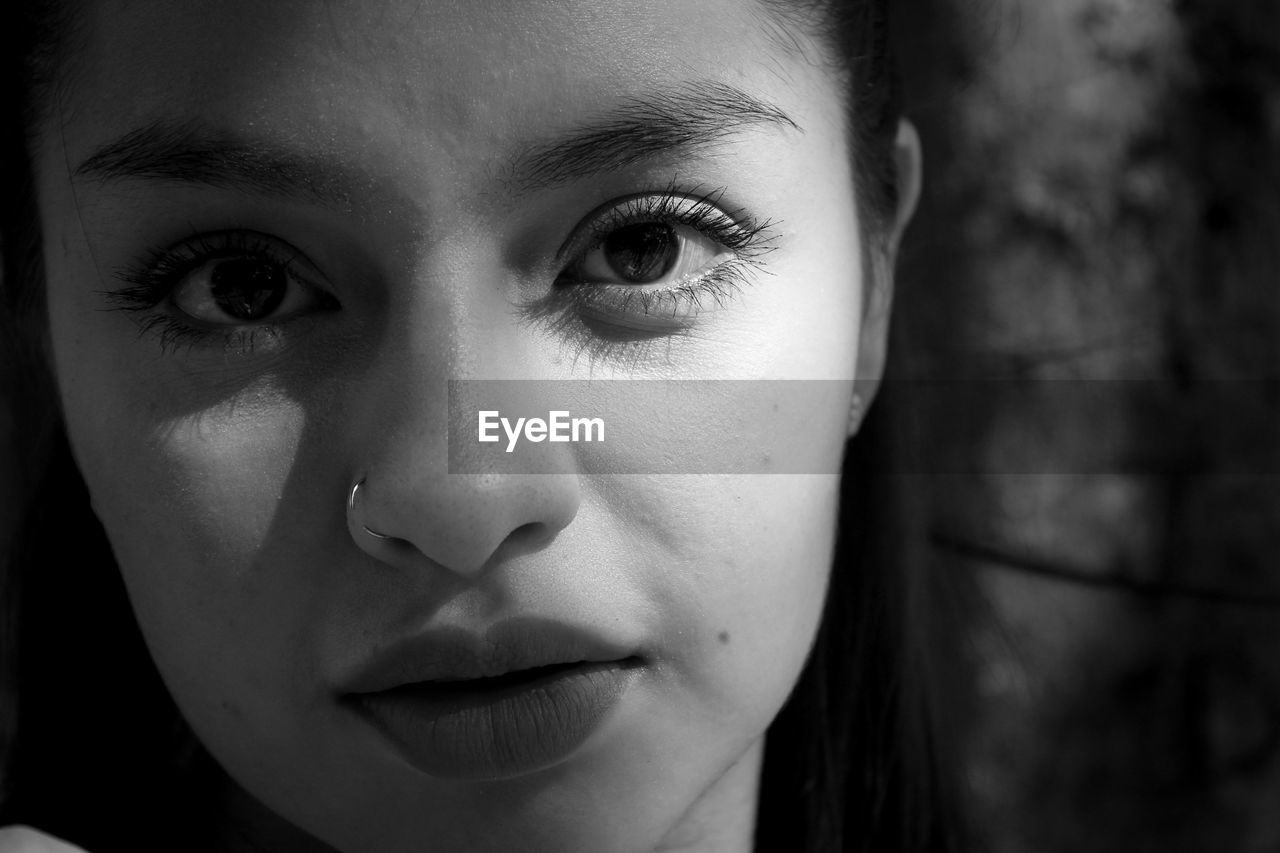 Close-up portrait of beautiful woman wearing nose ring