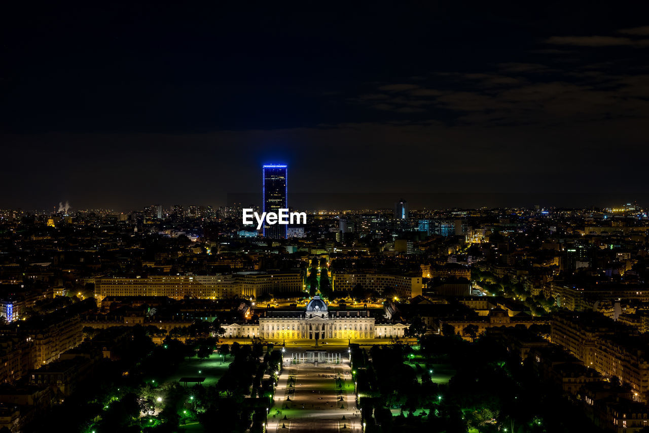 AERIAL VIEW OF ILLUMINATED CITY AT NIGHT