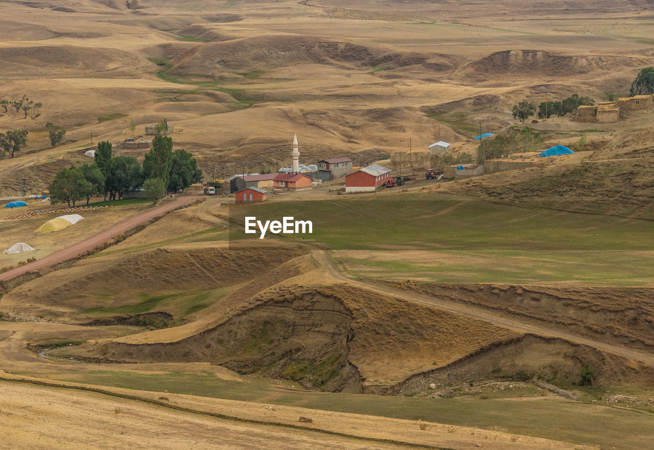 HIGH ANGLE VIEW OF AGRICULTURAL LANDSCAPE