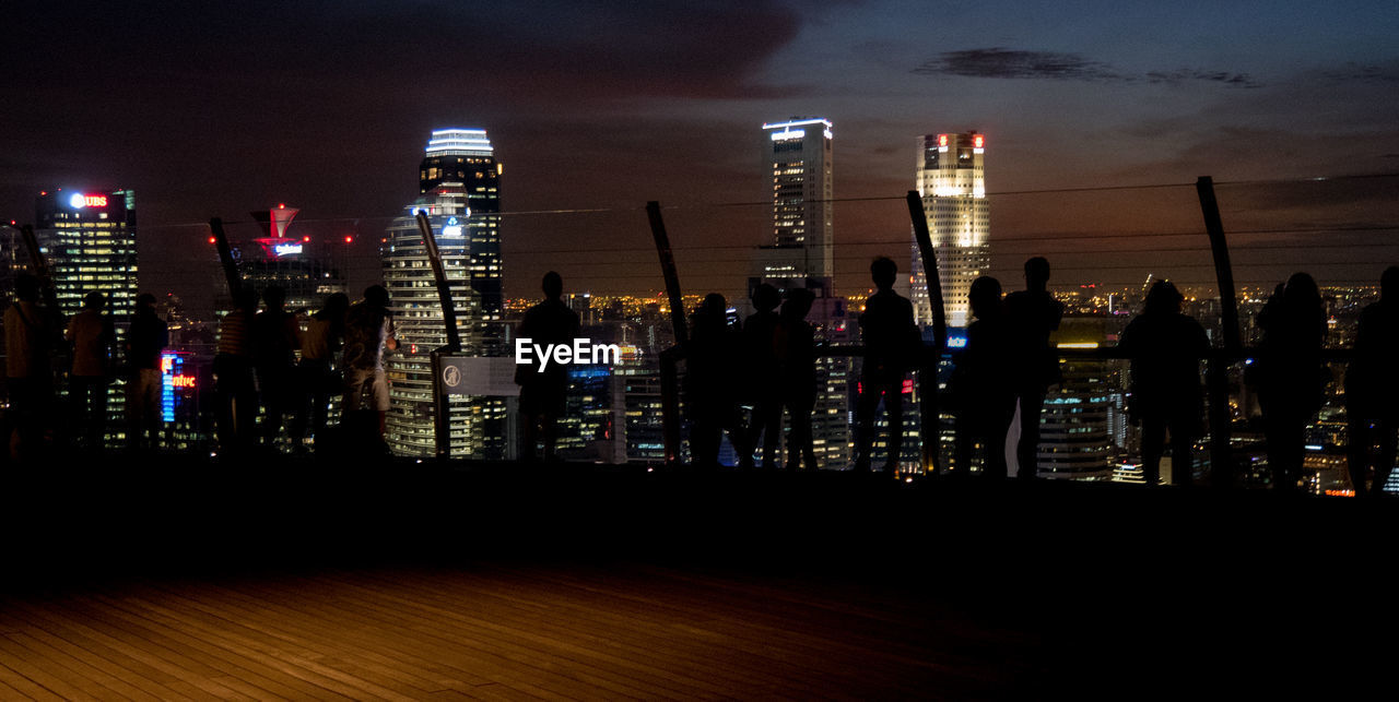 View of skyscrapers lit up at night