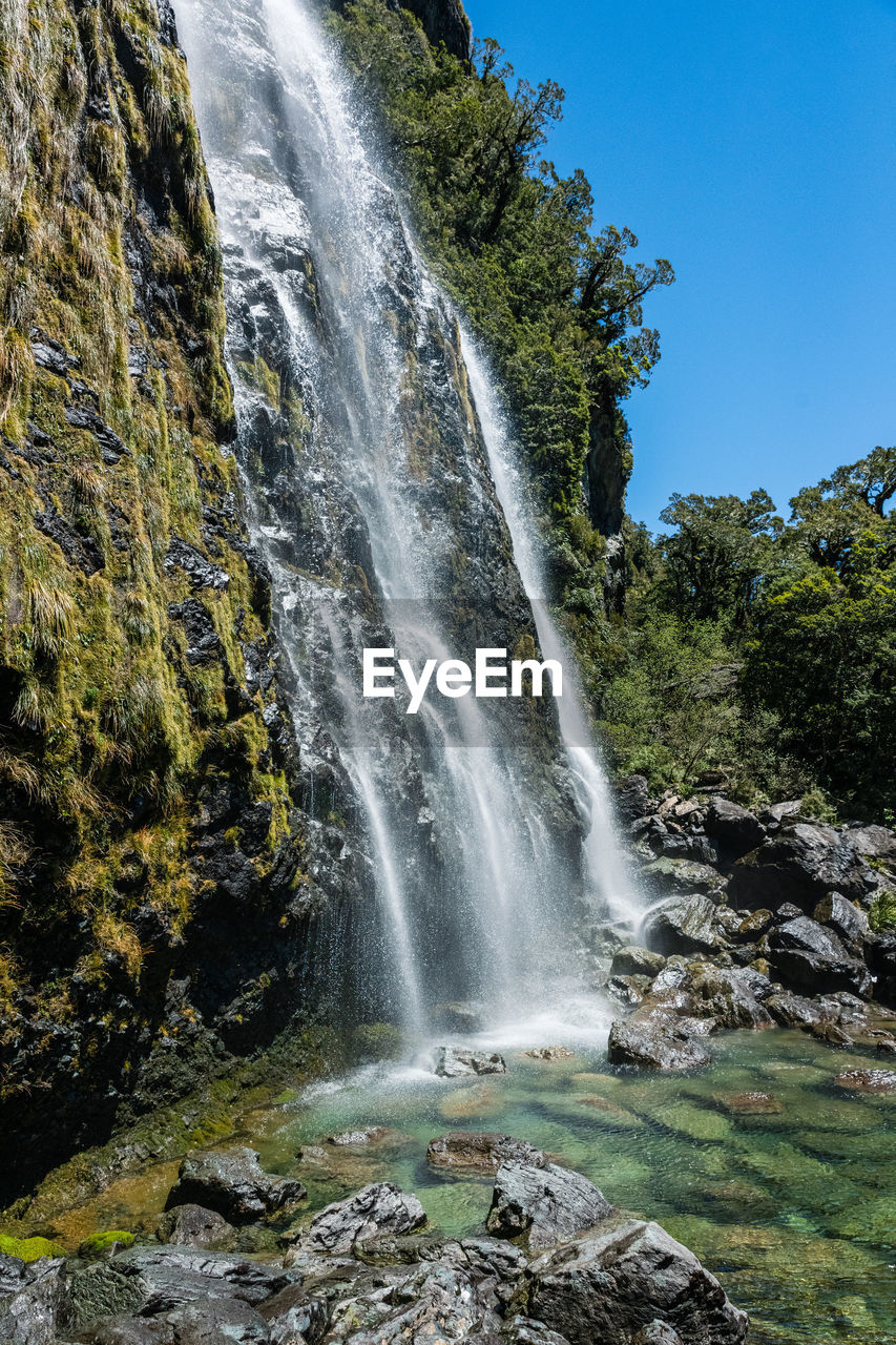 Low angle view of earland falls waterfall on rocks