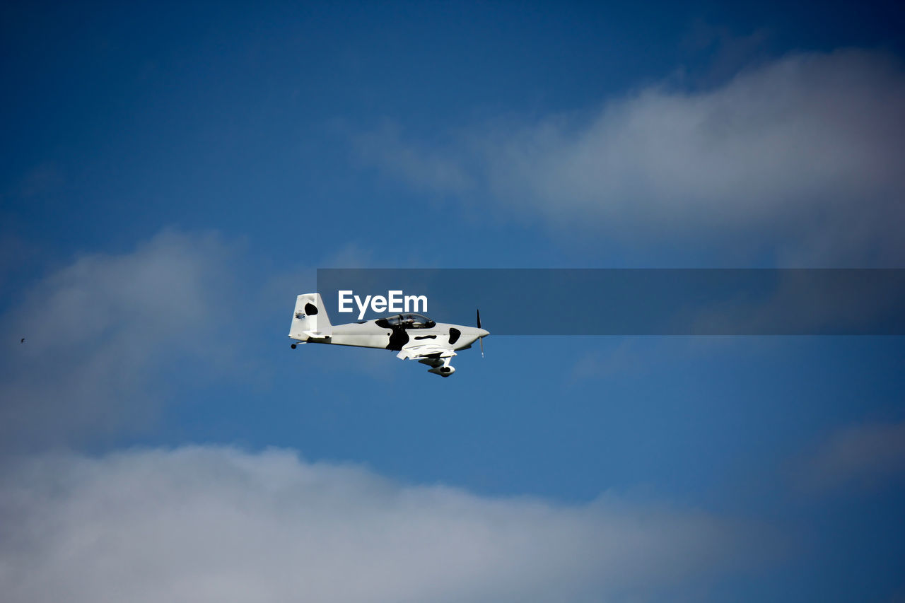 Low angle view of airplane flying in sky