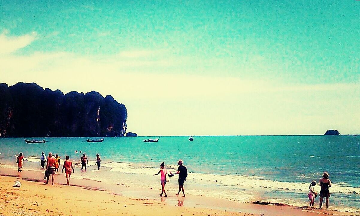 TOURISTS ENJOYING ON BEACH