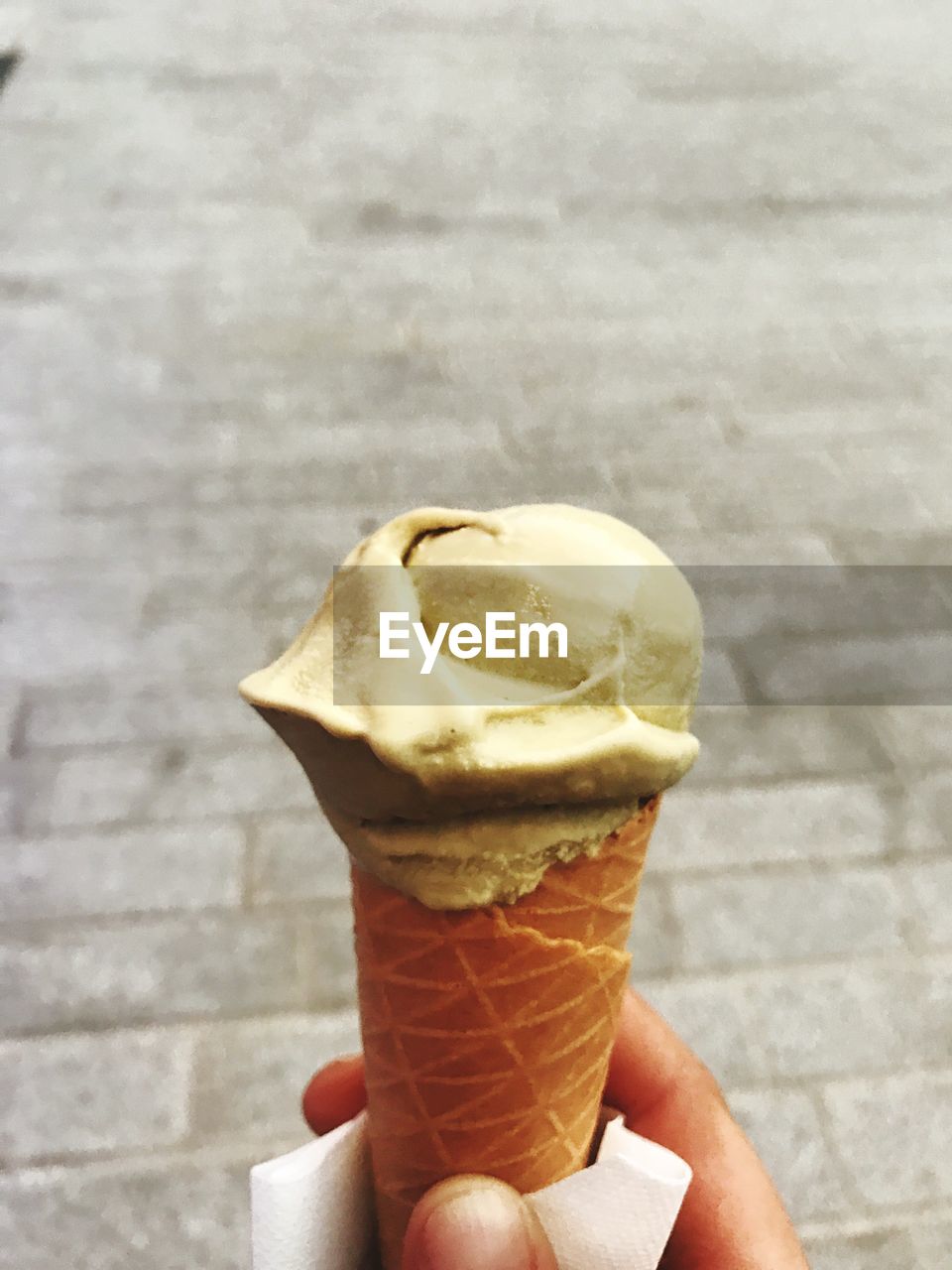 Cropped hand of man holding ice cream cone
