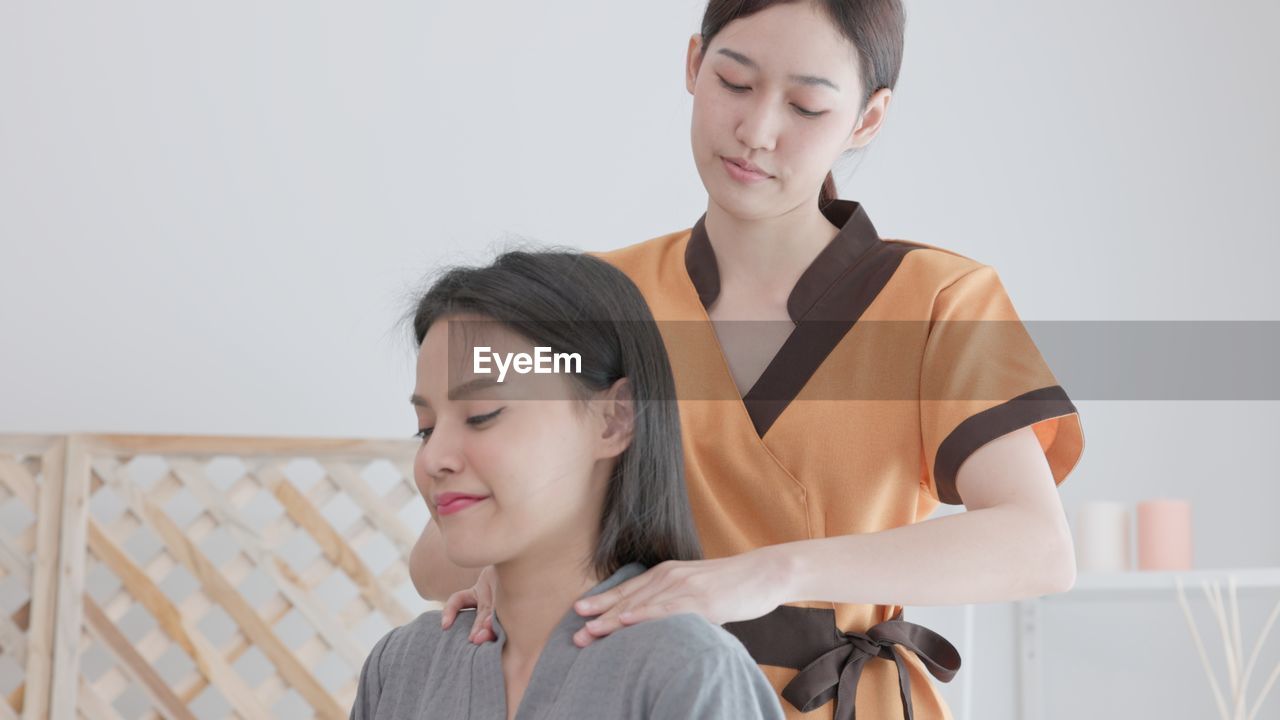 In a spa and beauty parlor, a woman. a female model sits and relaxes 