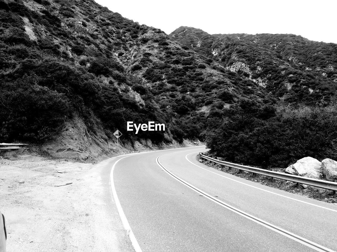 Scenic view of mountain road against sky