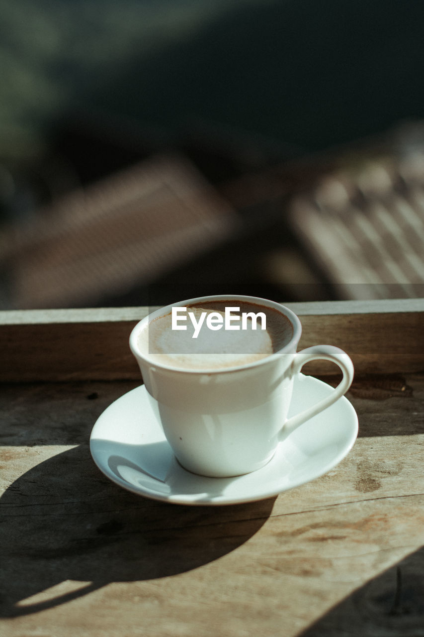 Close-up of coffee cup on table