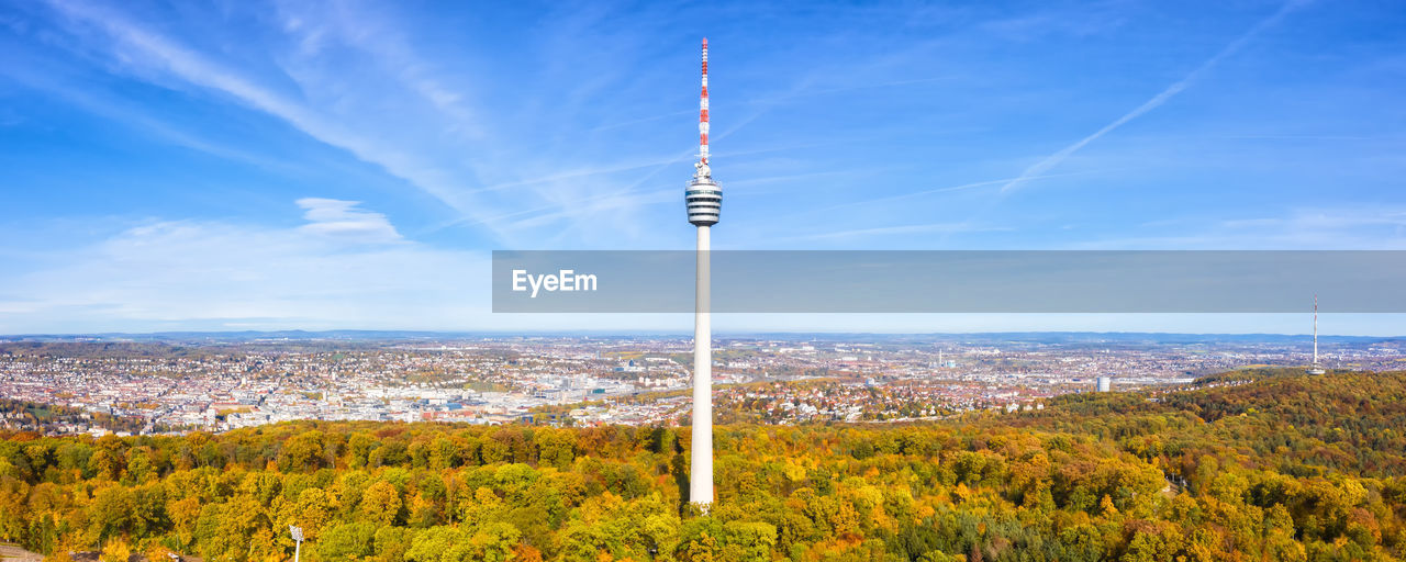 VIEW OF TOWER AND TREES IN CITY