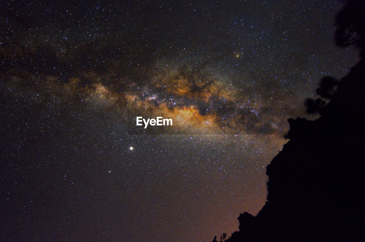 star, space, night, astronomy, sky, galaxy, beauty in nature, astronomical object, scenics - nature, milky way, nature, science, no people, outer space, space and astronomy, tranquility, constellation, dark, outdoors, low angle view, star field, tranquil scene, silhouette, environment