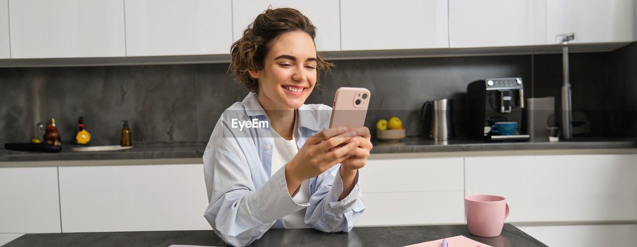 portrait of young man using mobile phone