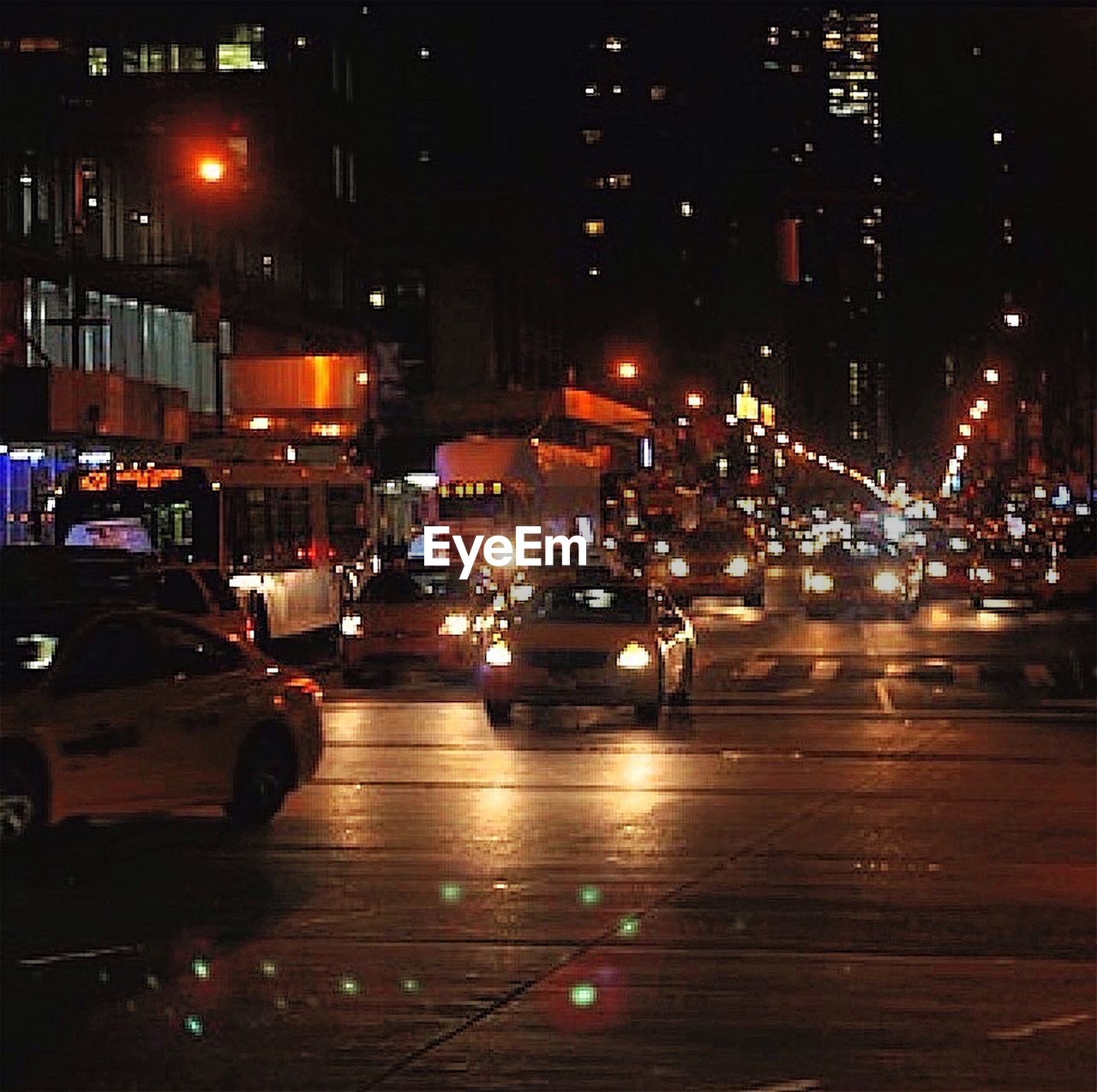 VIEW OF CITY STREET AT NIGHT