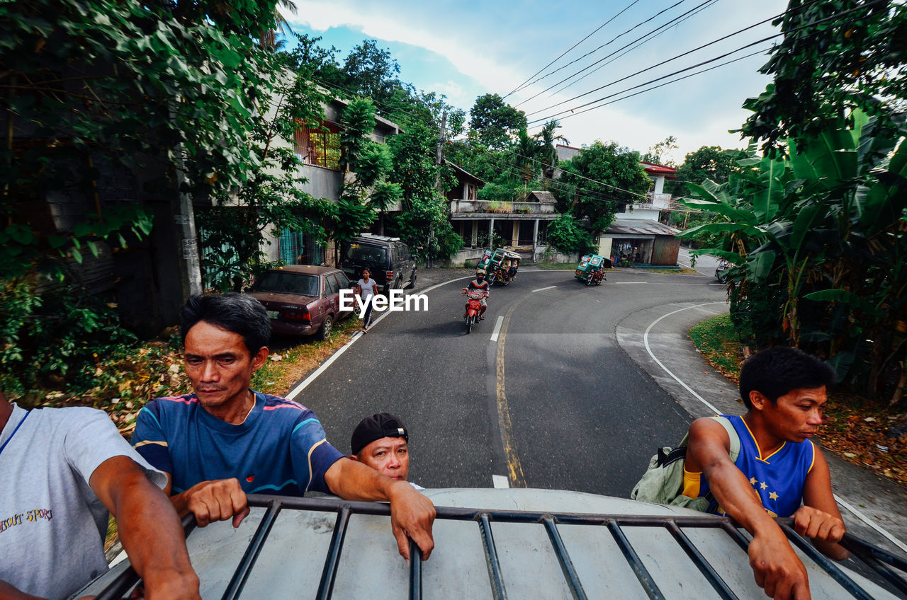 PEOPLE ON STREET IN CITY