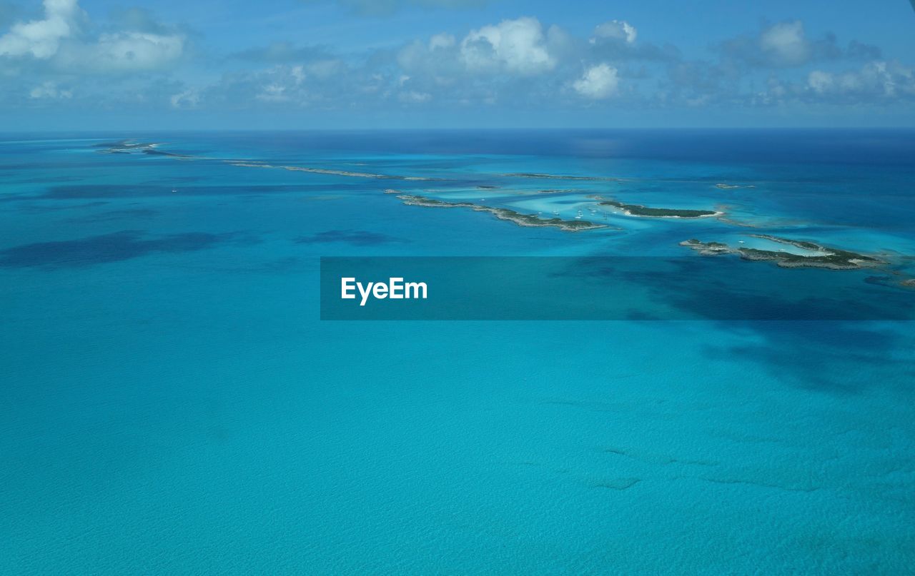 Scenic view of sea against blue sky