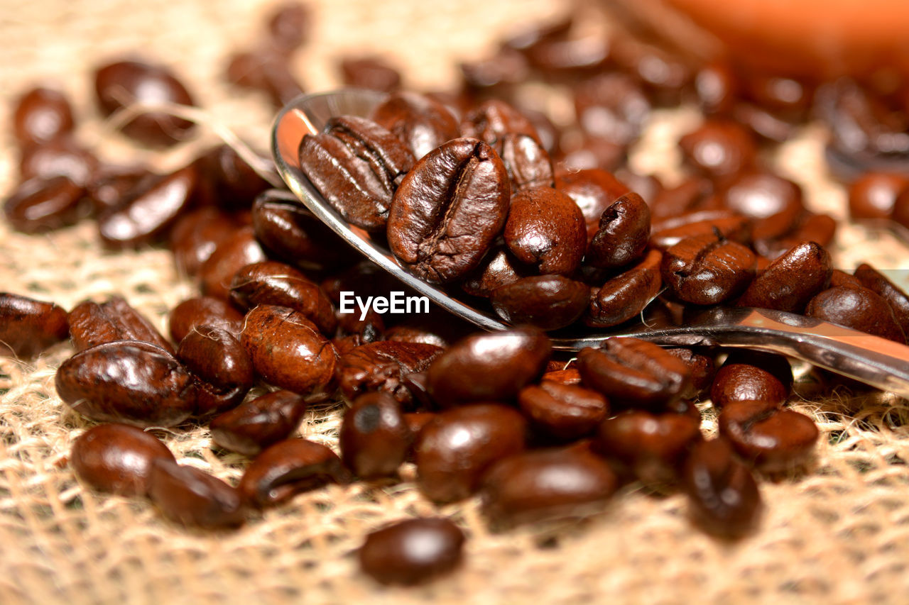 CLOSE-UP OF COFFEE BEANS IN GLASS