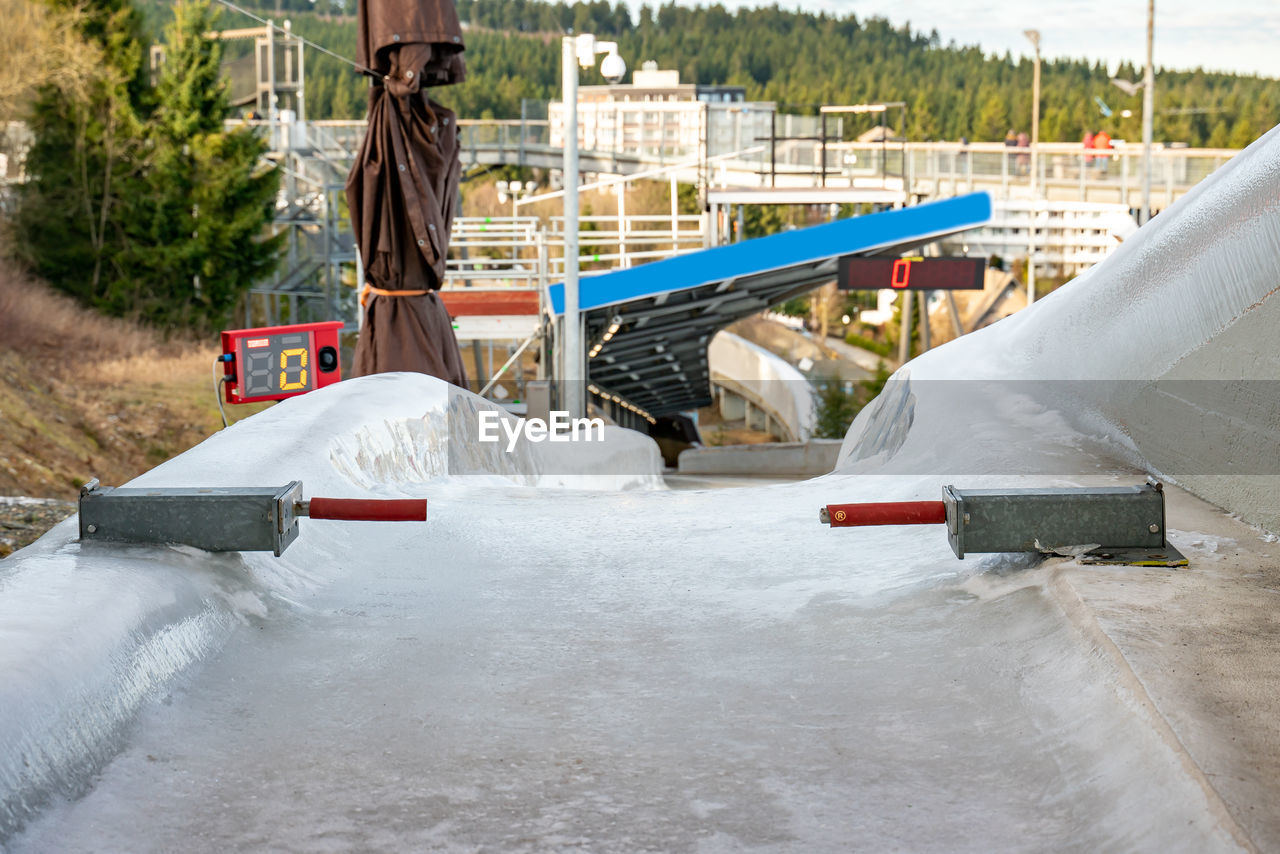 Bobsleigh ice channel in winterberg. the digital clock measures the speed. curvy trail in the ice.