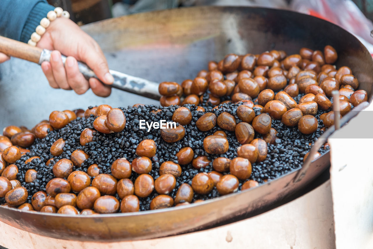 High angle view of person preparing food in container