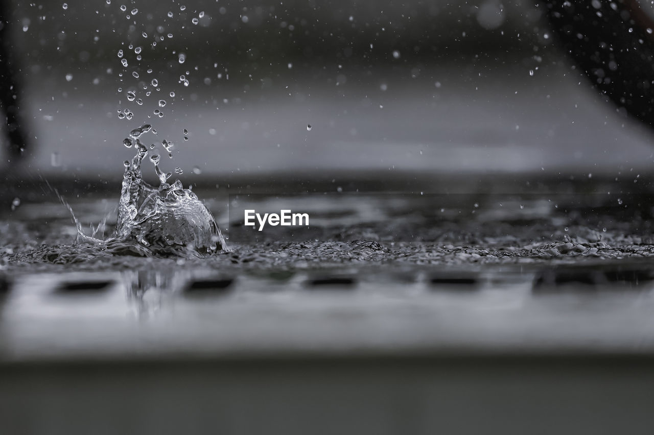 black and white, water, freezing, monochrome, selective focus, drop, snow, nature, monochrome photography, black, no people, motion, darkness, close-up, splashing, wet, outdoors, macro photography, rain, light, day, white