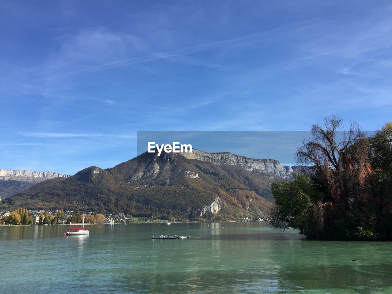 SCENIC VIEW OF LAKE AGAINST BLUE SKY