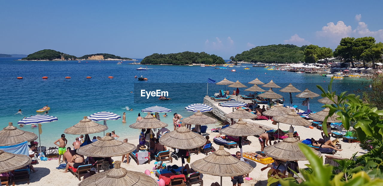 HIGH ANGLE VIEW OF PEOPLE ON BEACH