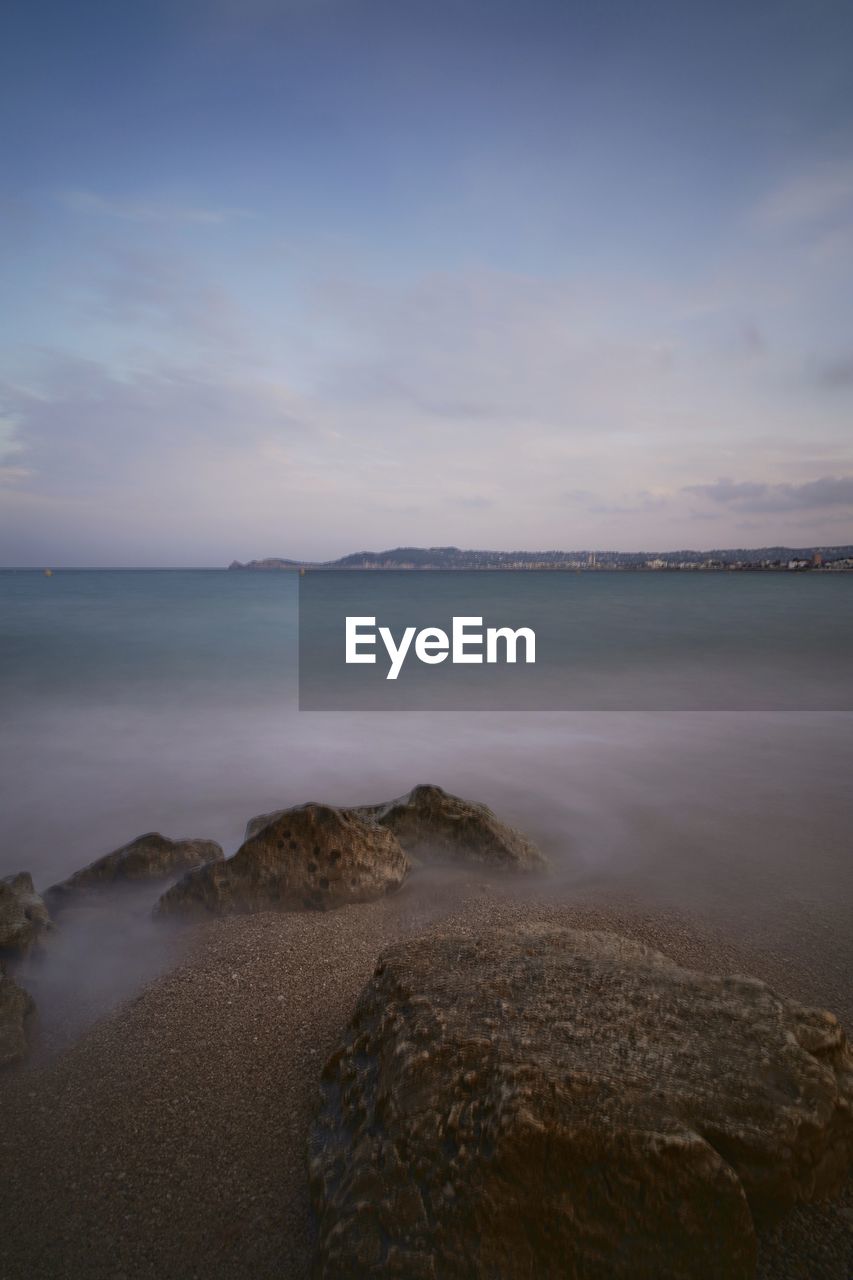 SCENIC VIEW OF SEA DURING SUNSET