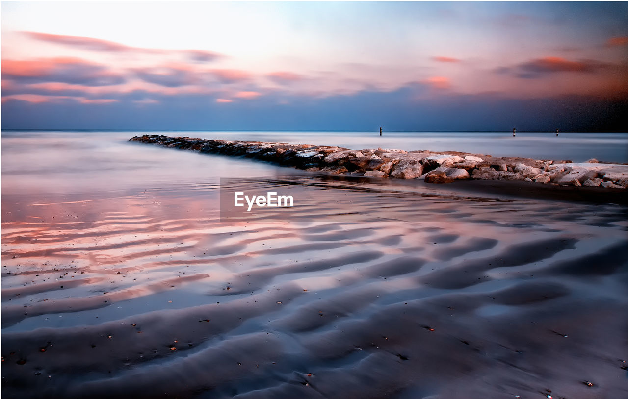 Scenic view of sea against sky during sunset