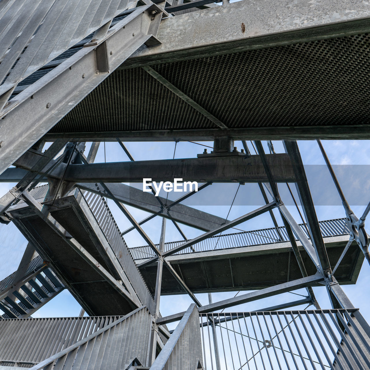 LOW ANGLE VIEW OF METALLIC STRUCTURE AGAINST SKY
