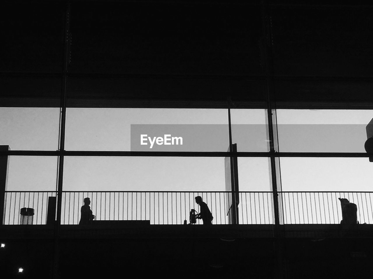 Low angle view of silhouette men at charles de gaulle airport